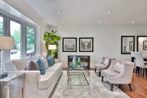 monochromatic room with beige area rug