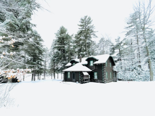 House in woods with snow